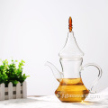 Théière en verre de feuille de thé de café avec le réchaud